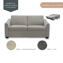 Loretta 2-Seater Sofa Bed in natural fabric, shown in upright sofa position with slim arms and modern silhouette.