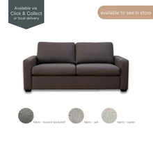 Riley Double Sofa Bed in licorice fabric with plush cushions and clean lines, shown in upright sofa position.