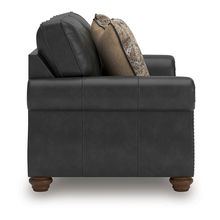 Side profile of Ashley Shadsburne 2 Seater Sofa highlighting soft Earth Granite leather-look fabric and timber-look legs.