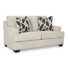 Angled studio view of Heartcort Quartz 2-seater sofa highlighting deep seating comfort and accent cushion textures.