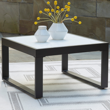 Outdoor coffee table with marble-look top and black metal base