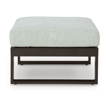 Ottoman image showing matching modular design and textured cushion