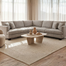 Anthem corner lounge in a modern living room setting with neutral tones and timber furniture