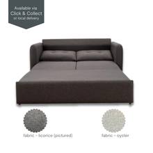 Eric sofa bed fully extended into bed position, upholstered in licorice fabric, ideal for guest rooms or multipurpose spaces.