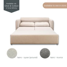 Eric sofa bed extended into sleeping position, shown in light oyster fabric with metal pull-out frame visible, pictured on white background.