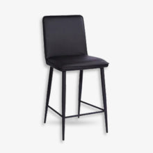 Haven bar stool in black PU with slim black metal legs and integrated footrest