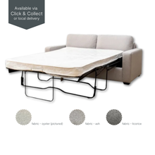 Angled view of Riley Double Sofa Bed in oyster fabric, shown with mattress extended.