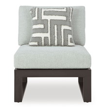 Straight-on view of individual sofa piece with patterned cushion