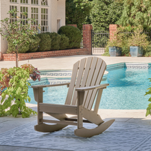Beige Sundown Treasure rocking chair beside a pool setting – perfect outdoor relaxation in the Riverina sun.